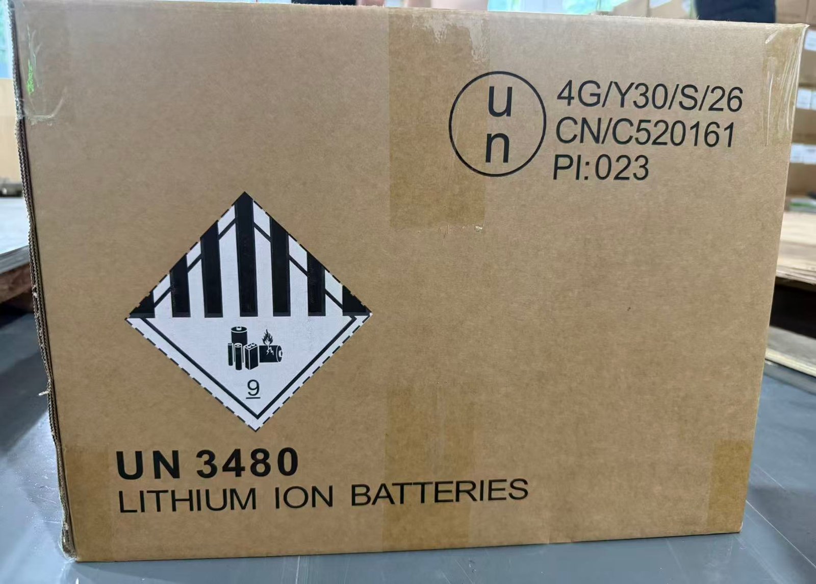 Outer carton photographed with lithium battery transport marking before dispatch
